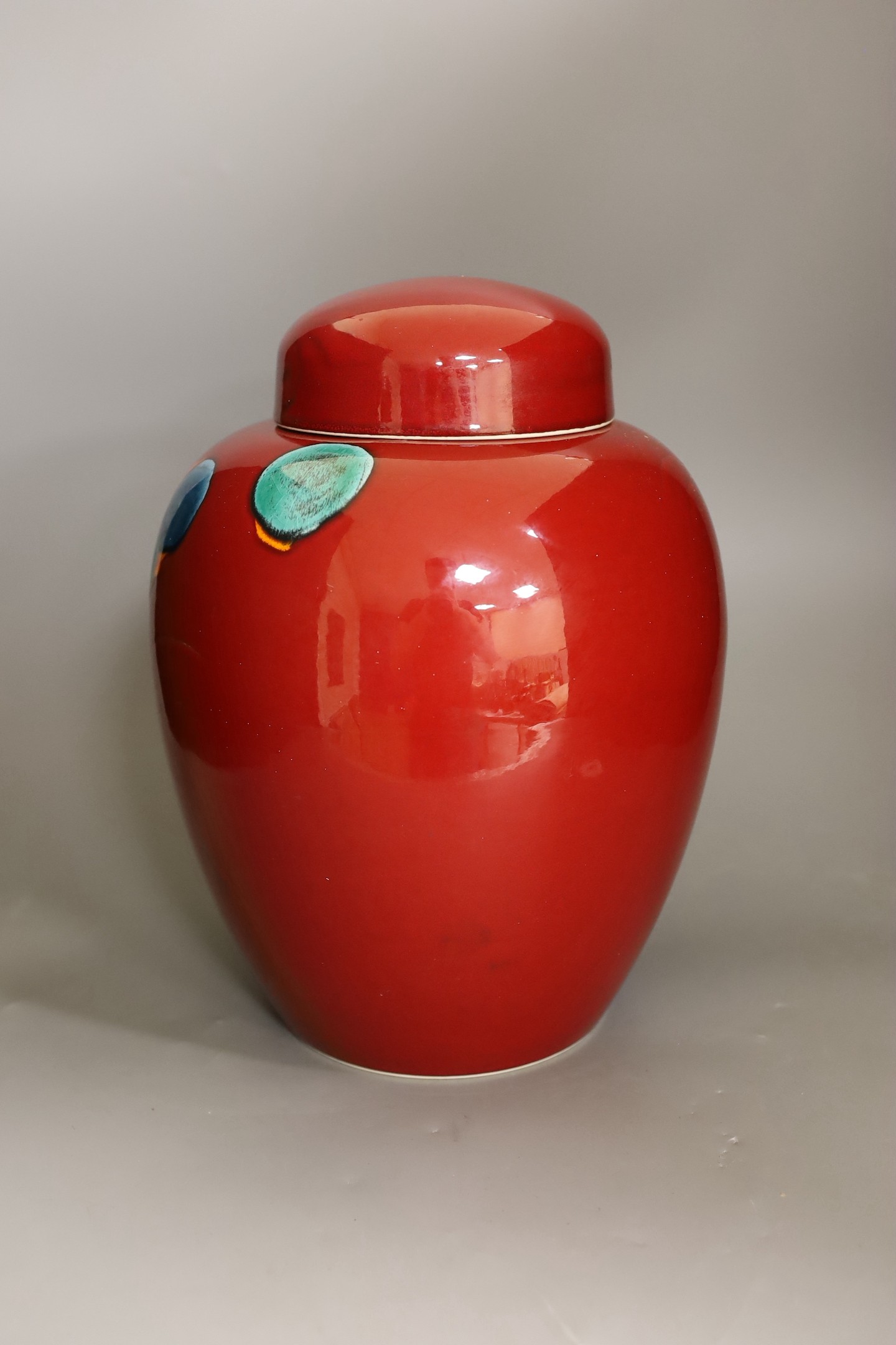 A large Poole Volcano design jar and cover, 32cm high